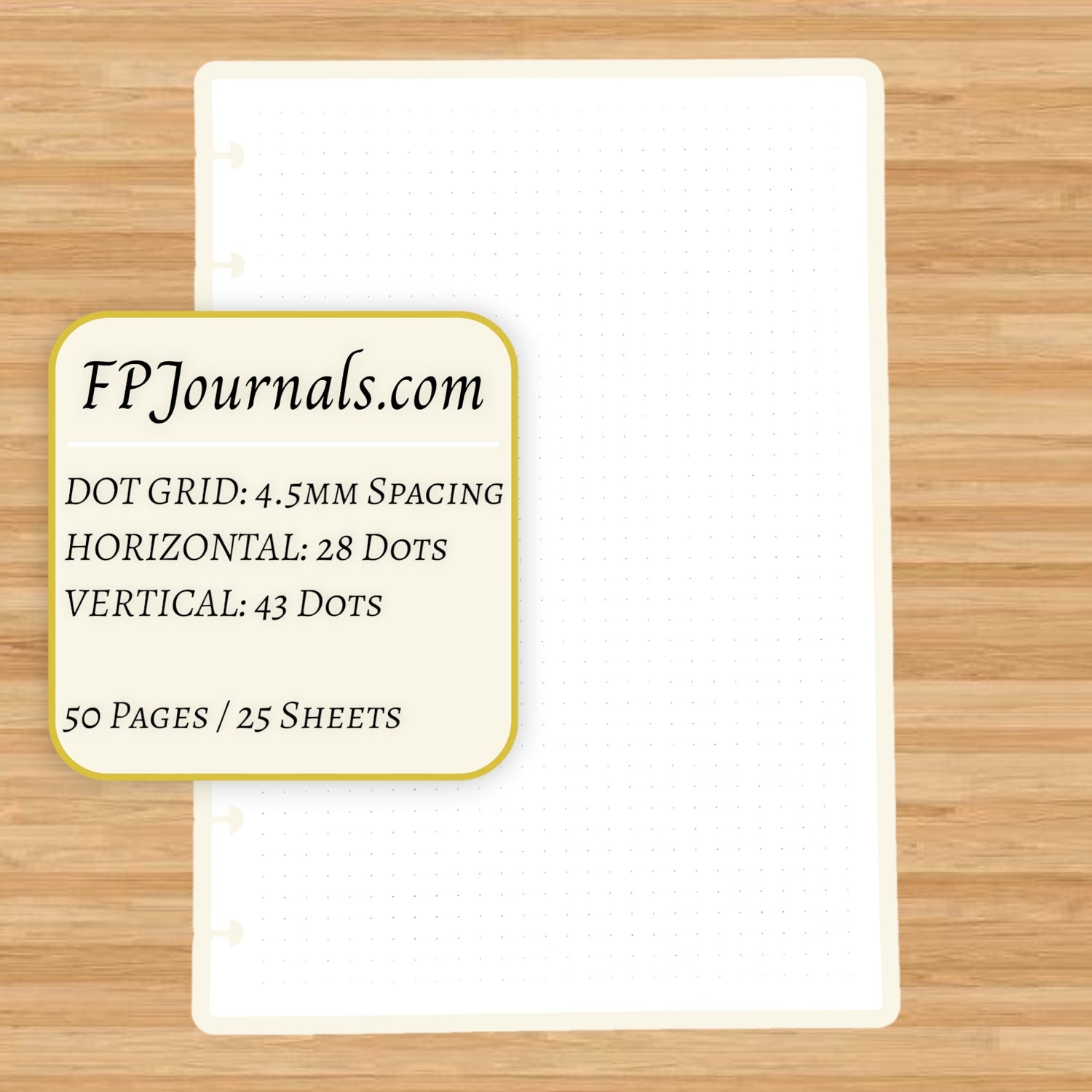 Dot Grid Discbound Notebook Insert - A5 Junior - Dot Grid - Fountain Pen Friendly Paper showing a sheet with 4.5mm dot spacing, 28 horizontal and 43 vertical dots, 50 pages, on a wooden surface.