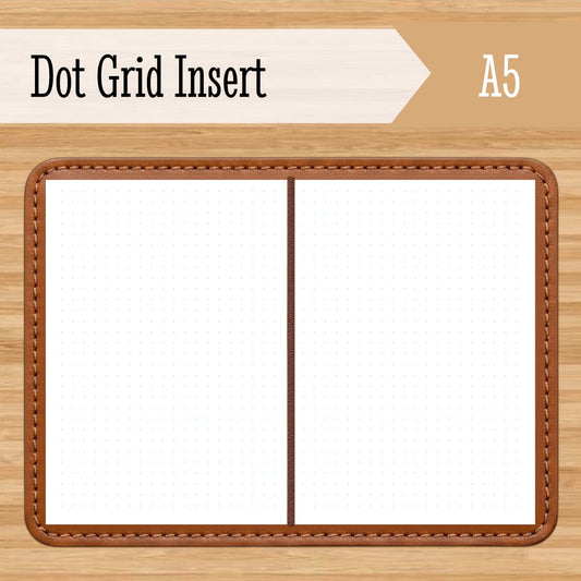 Dot grid insert with brown leather-like border on a wooden background