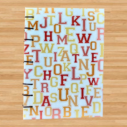 University Monogram - A6 - Lined - Coptic Bound - Fountain Pen Notebook - Handmade Journal with colorful alphabet cover and visible coptic stitched binding